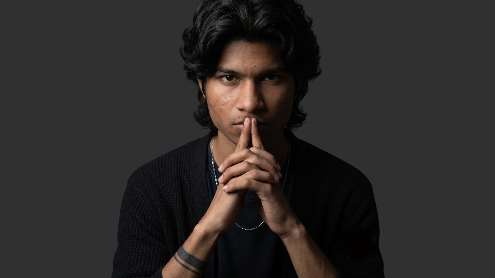 Vivek Hands Steepled Portrait